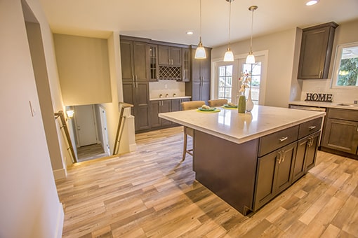 A white kitchen with brown cabinets near where Encore Realty provides Chula Vista property management